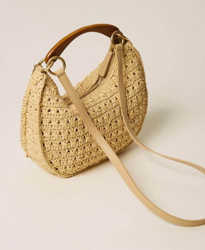 Raffia 'Croissant' bag with charms