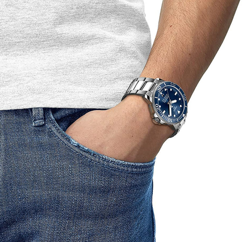 שעון TISSOT דגם T1204071104103 לגבר לוח כחול רצועת פלדת אל-חלד בצבע אפור – תמונה 2