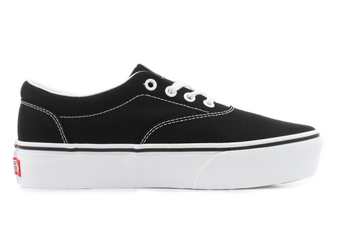 black canvas slip on vans