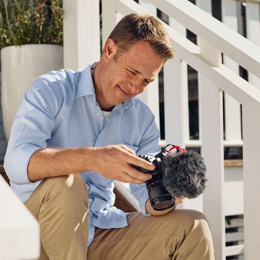 man holding camera with video-micro-II with windshield