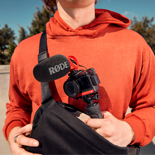 man holding bag camera with video-micro-II