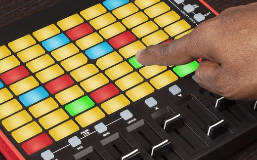 Akai Pro APC mini mk2 with a finger on a pad